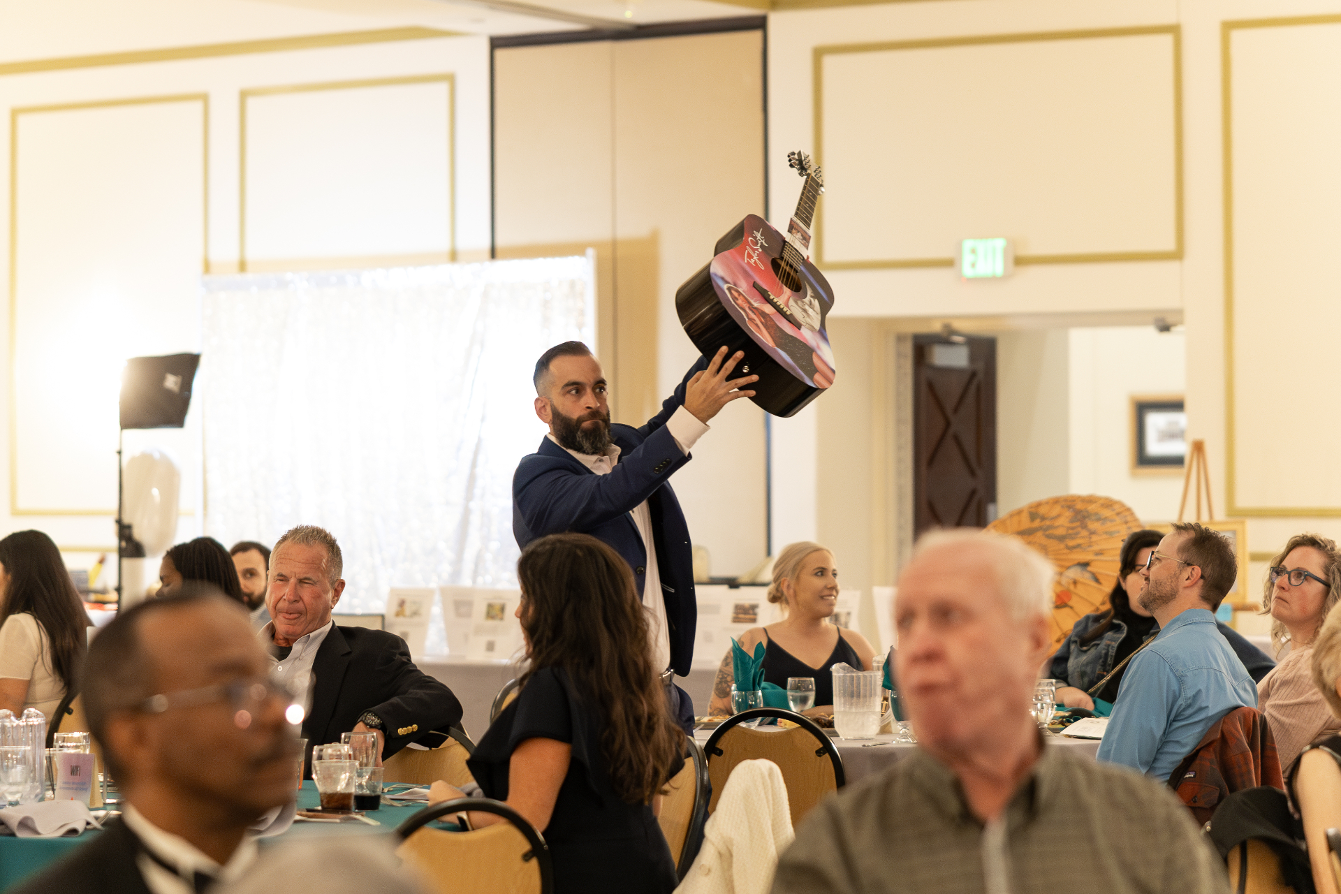 CBA auctioneer working the room mid-bid